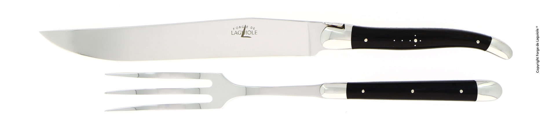Tranchiermesser und Fleischgabel der Marke Forge de Laguiole mit schwarzen Griffen und glänzender Metallklinge, nebeneinander liegend